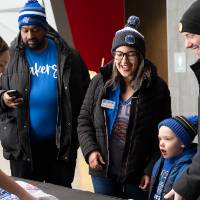 Group of three picking up their custom crewnecks